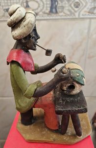Homem trabalhando com cachimboLuiz Galdino de Caruaru, PEDécada 197018 cm de altura
